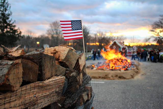 The American flag flies at the Riverhead Business Improvement District's Holiday Bonfire Saturday evening. (Credit: Elizabeth Wagner)