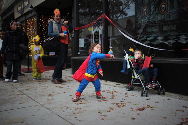 Superman Liam of Long Beach rocking out to the DJ in front of Vines & Hops.