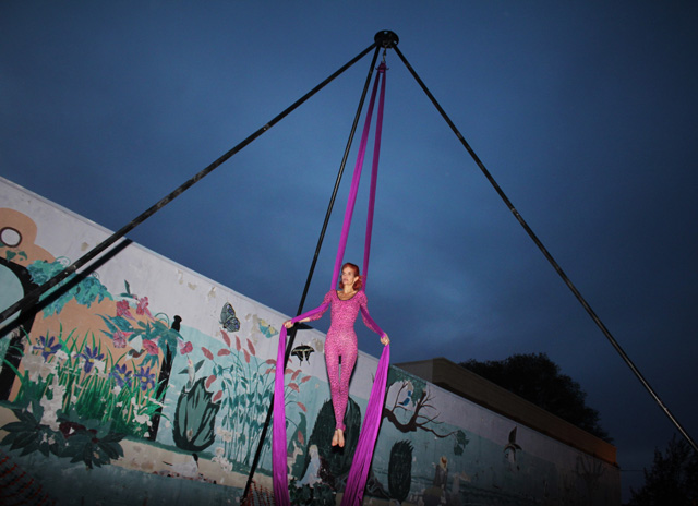 Robin Lynch, aerialist, captivating the crowd as she performs in her 20ft high aerial rig. 
