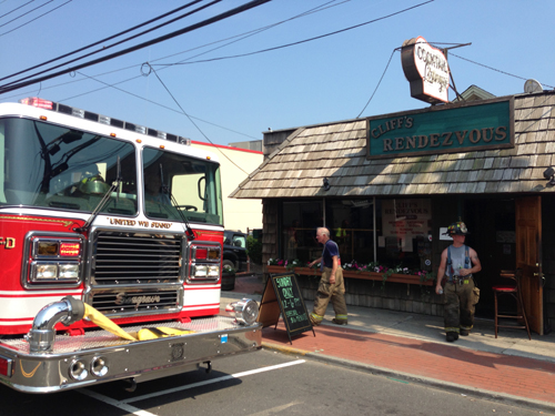 PAUL SQUIRE PHOTO | Riverhead firefighters outside Cliff's Rendezvous after last Tuesday's grease fire.