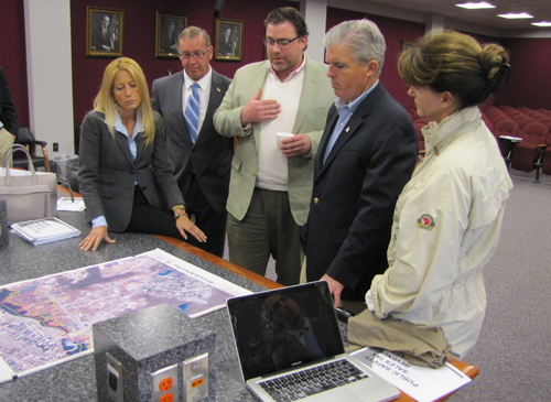 County Executive Steve Bellone, second from right, discusses Southampton Town's Riverside plans with, from left, Councilwoman Christine Scalera, Councilman Brad Benter, Sean McLean of Renaissance Downtowns, and Southampton Supervisor Anna Throne-Holst. (Credit: Tim Gannon)