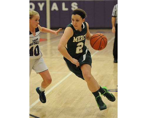 ROBERT O'ROURK PHOTO | Kayla Schroeher of Bishop McGann-Mercy charging toward the basket while Port Jefferson's Jillian Colucci tries to stop her.