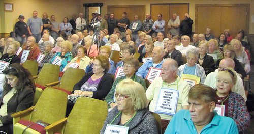 TIM GANNON PHOTO | Angry residents of Foxwood Village and Millbrook Community filled the meeting room during the Riverhead Planning Board's special meeting on The Shops of Riverhead Tuesday.