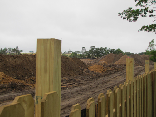 TIM GANNON FILE PHOTO  |  The fence that runs along Foxwood Village and the Shops at Riverhead property lines.