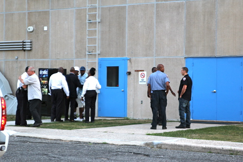 A group of New York City corrections officers at the scene. (Credit: Jennifer Gustavson)
