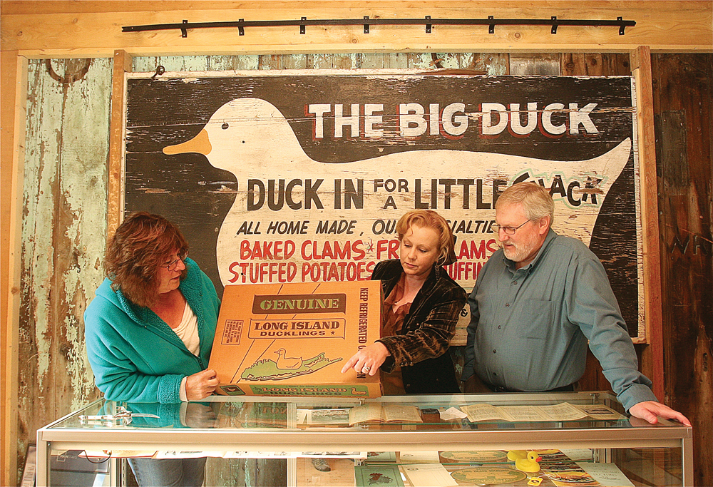 Friends of the Big Duck Ranch vice president Fran Cobb (from left) in the Big Duck Museum's newly renovated barn with co-curators Lisa Dabrowski and David Wilcox. (Credit: Barbaraellen Koch)