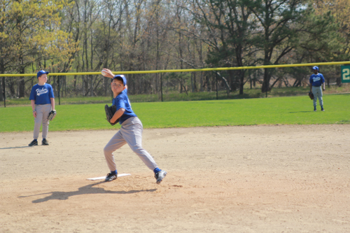 JENNIFER GUSTAVSON FILE PHOTO | The Flanders Little League Opening day has been postponed. Here's Fisher Landscaping pitcher Chris, 11, warming up at last year's event.