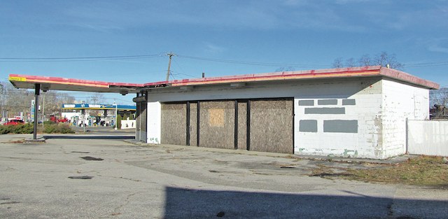 This boarded-up former gas station in Riverside is one of nine properties to be cleaned up using grant money awarded to Southampton Town.