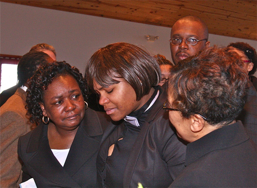 BARBARAELLEN KOCH PHOTO  |  Demitri Hampton's cousin Latisha Diego (center) is helped by other mourners as she goes up to view the casket for the final time before it is closed.
