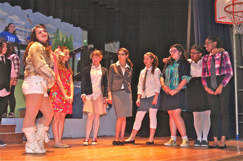 "HIgh School Musical' Drama Club president Sharpay Evans played by Kierra Prentiss (far left) and 'new student' Gabriella Montez played by Marissa Murgolo (second from left) in the opening scene.