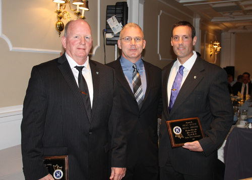 PAUL SQUIRE PHOTO | Officer Dennis Cavanagh (left) and Michael Lombardo (right) stand with Captain Richard Smith after winning the Riverhead police department's Officer of the Year awards.