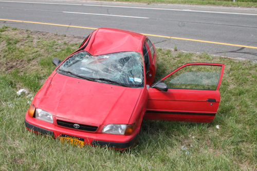 PAUL SQUIRE PHOTO | The driver of this Toyota Tercel walked away from a rollover crash on County Road 105 Tuesday afternoon.