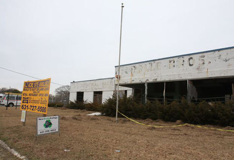 BARBARAELLEN KOCH FILE PHOTO | The Rolle Brothers building that fronted Route 58 in Riverhead just days before it was torn down in February 2010.