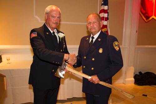 Chief Sean McCabe (left) shakes hands with Firefighter of the Year award-winner Howard Waldman (Credit: Jamesport Fire Department)