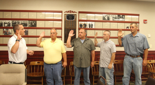 PAUL SQUIRE PHOTO | (L-R) Riverhead Fire Disctrict chairman Ed Carey swears in Chief Joseph Raynor, First Assistant Chief Kevin Brooks, Second Assistant Chief Pete Jackman, and Third Assistant Chief Timothy Corwin
