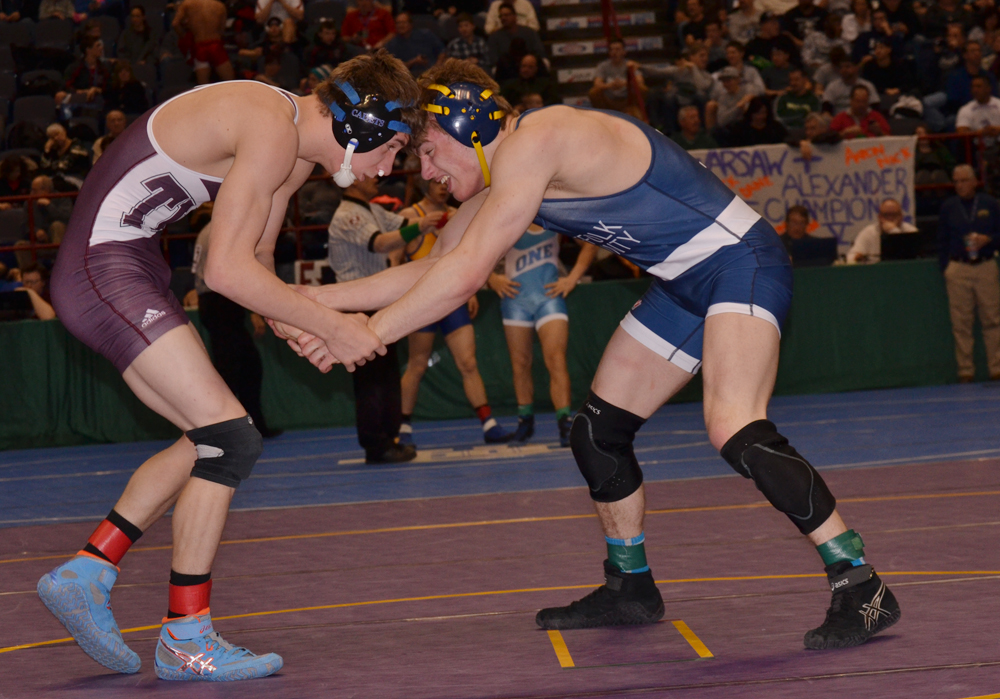 Jack Taddeo of Shoreham-Wading River (right) wrestles in the 145-pound first round Friday against Joseph Clemente of LaSalle. (Credit: Paul Wager)