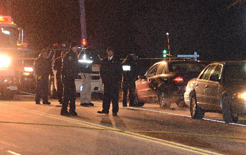 Police investigate the scene of the fatal accident Tuesday night. (Credit: AJ Ryan/Stringer News)
