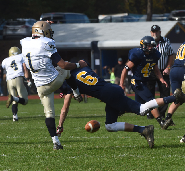 Jason Curran blocks a Bayport punt to help set up Shoreham's first touchdown Saturday. (Credit: Robert O'Rourk)