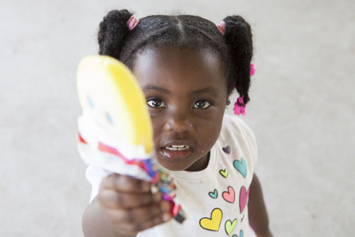 Amber Williams, 2, of Riverhead, demonstrating the importance of sharing at tk (Credit: Katharine Schroeder photos)