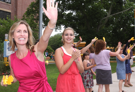 BARBARAELLEN KOCH PHOTO | Roanoke elementary teachers and other staffers wave goodbye to their students Friday afternoon.