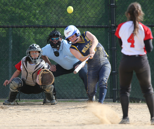 Shoreham-Wading River’s Brittany Mahan connecting on a pitch from Mount Sinai’s Holly Drasser. (Credit: Garret Meade)