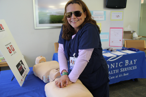 Patricia Monzon, a nurse a PBMC Health demonstrates CPR compressions during Nurses Week's Community Health Fair on Wednesday | CARRIE MILLER PHOTO