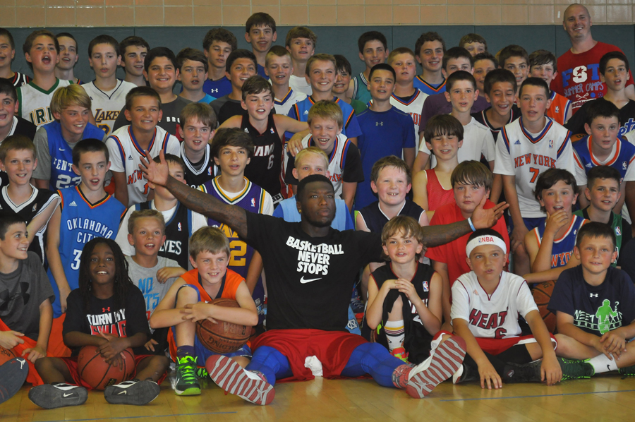 NBA guard Nate Robinson poses for a picture during Tuesday's camp at McGann-Mercy High School. (Credit: Joe Werkmeister)