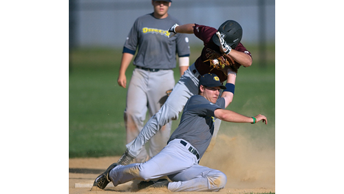 North Fork shortstop Luke Stampfl applied a tag, but Riverhead's Cole Fabio is called safe on his steal of second base in the third inning. (Credit: Garret Meade)