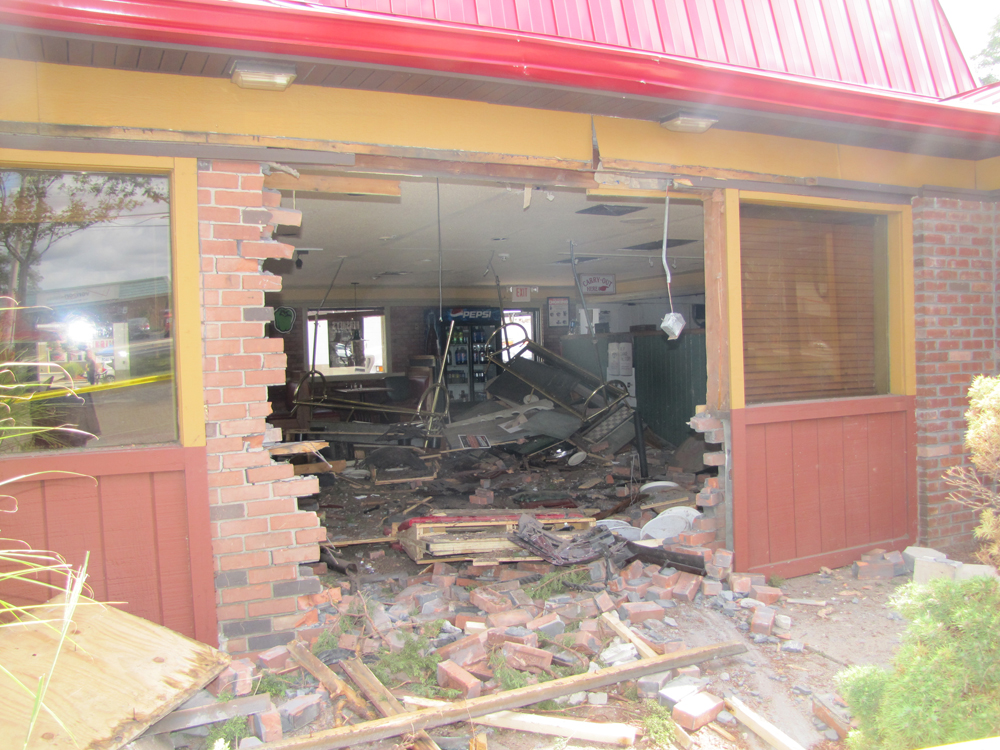 The Riverhead Pizza Hut, following a Sept. 17 accident in which a car crashed into it. File photo by Tim Gannon