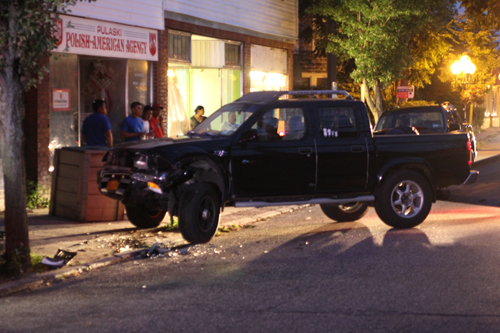 A taxi cab crashed into this parked pickup truck Sunday night, officials said. (Credit: Jennifer Gustavson)