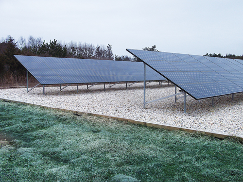 GREENLOGIC COURTESY FILE PHOTO  |  A ground-mounted solar array similar to one that was installed on Gabrielsen Farms' Aquebogue greenhouse.