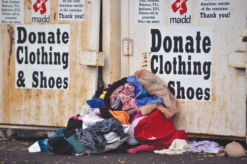 A clothing bin in the TJ Maxx shopping center was overfilled with clothes this week. (Credit: Grant Parpan)