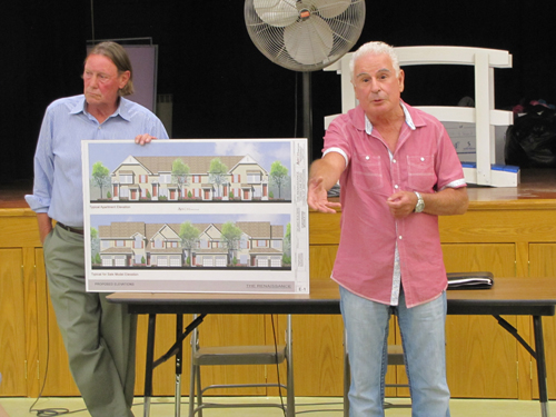 Builder Vincent DiCanio, right, explains his plans to the Calverton Civic Association as group president Rex Farr looks on