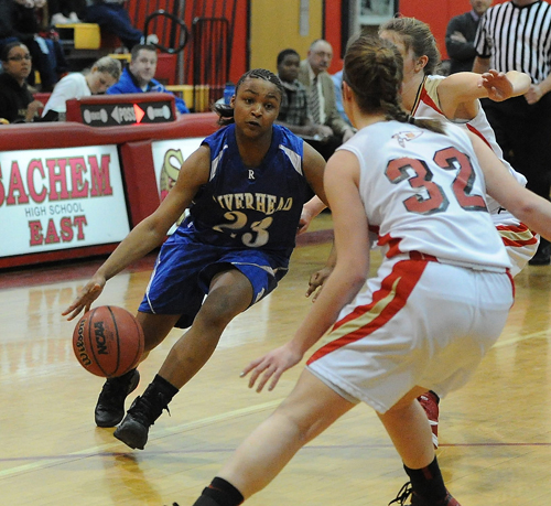 ROBERT O'ROURK PHOTO | Riverhead's Shanice Allen finds her path to the basket blocked by Sachem East's Sammy Drake.