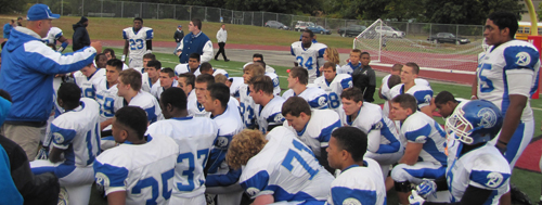 Riverhead coach Leif Shay addressing his players following their win over Newfield. (Credit: Tim Gannon)