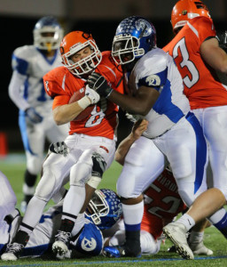 DANIEL DE MATO PHOTO | Carey running back Mike DeLeo is stopped by Riverhead defensive lineman Jonathan Lee for no gain.