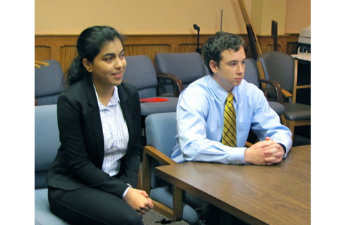 Stony Brook business students Neha Shethia and Justin Kline present their EPCAL study to the Town Board Thursday. (Credit: Tim Gannon)