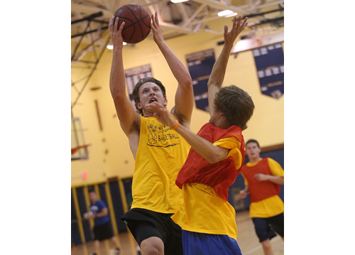 Dan Hughes, attacking the basket during Shoreham-Wading River's intrasquad scrimmage last Thursday night, has ball skills to go with his 6-foot 5-inch frame. (Credit: Garret Meade)