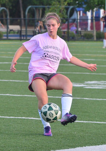 ROBERT O'ROURK PHOTO | Theresa Bender of Shoreham-Wading River making a pass during her team's 1-0 playoff win over Miller Place.