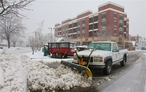 Gary Hubbard, B&G worker, clearing the heavy slushy snow from the town parking lot by Summerwind Apartments. (Barbaraellen Koch Photo)