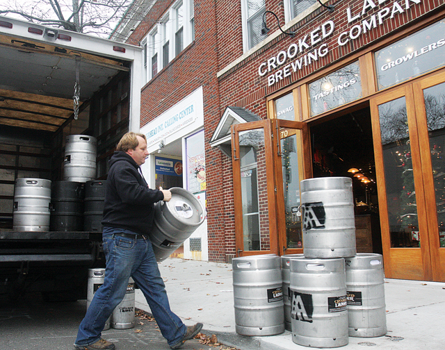 Crooked Ladder co-owner Duffy Griffiths unloading empty kegs at Crooked Ladder in December. (Credit: Barbaraellen Koch)