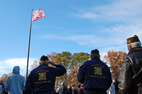 JOSEPH PINCIARO PHOTO | A member of the Riverhead VFW salutes the flag on Veterans Day 2013.
