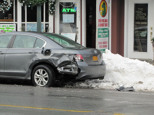 TIM GANNON PHOTO | This car was struck in Hampton Bays after a fatal car crash early Sunday morning.