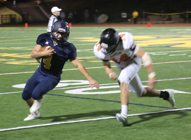 Shoreham-Wading River running back Chris Gray tries to cut to the outside. (Credit: Joe Werkmeister)