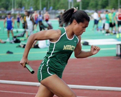 McGann-Mercy's Julianna Cintron runs the opening leg of the 4 x 100 relay at last week's state championship. The team ran again at nationals Friday. (Credit: Hal Henty)