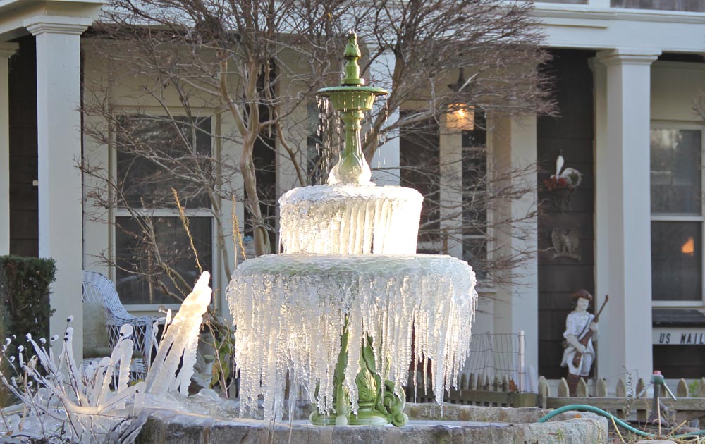 More ice than water could be seen on one Main Road fountain Wednesday. (Credit: Carrie Miller)