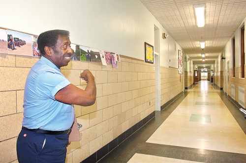 BARBARAELLEN KOCH PHOTO | Head custodian Carl James in the hallway of Pulaski Street Elementary School, where he started working almost 54 years ago.