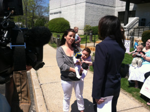 Andrea Zeledon-Mussio speaks with a reporters.