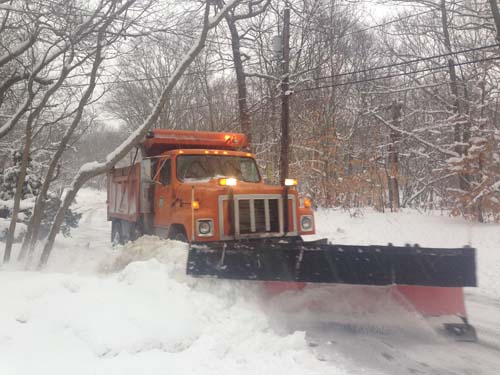 JOSEPH PINCIARO PHOTO | A highway crew plow makes its way through Wading River shortly after 8 a.m.