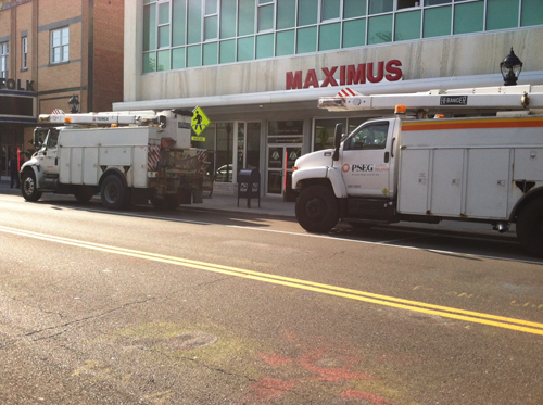 PSEG utility trucks in downtown Riverhead during Friday afternoon's power outage. (Credit: Mike White)